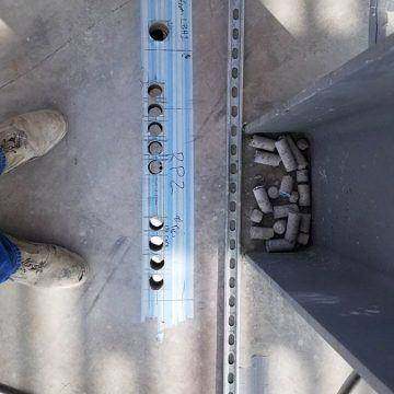 Core slugs laid out beside the holes they came from