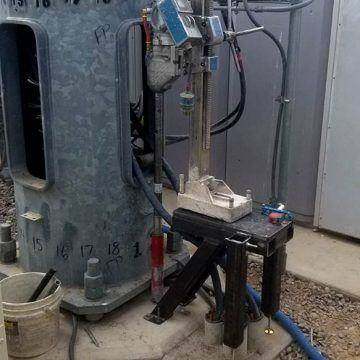 Core rig anchored to a floor inside an occupied building