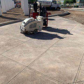 Soff-Cut saw cutting joints on an exterior slab