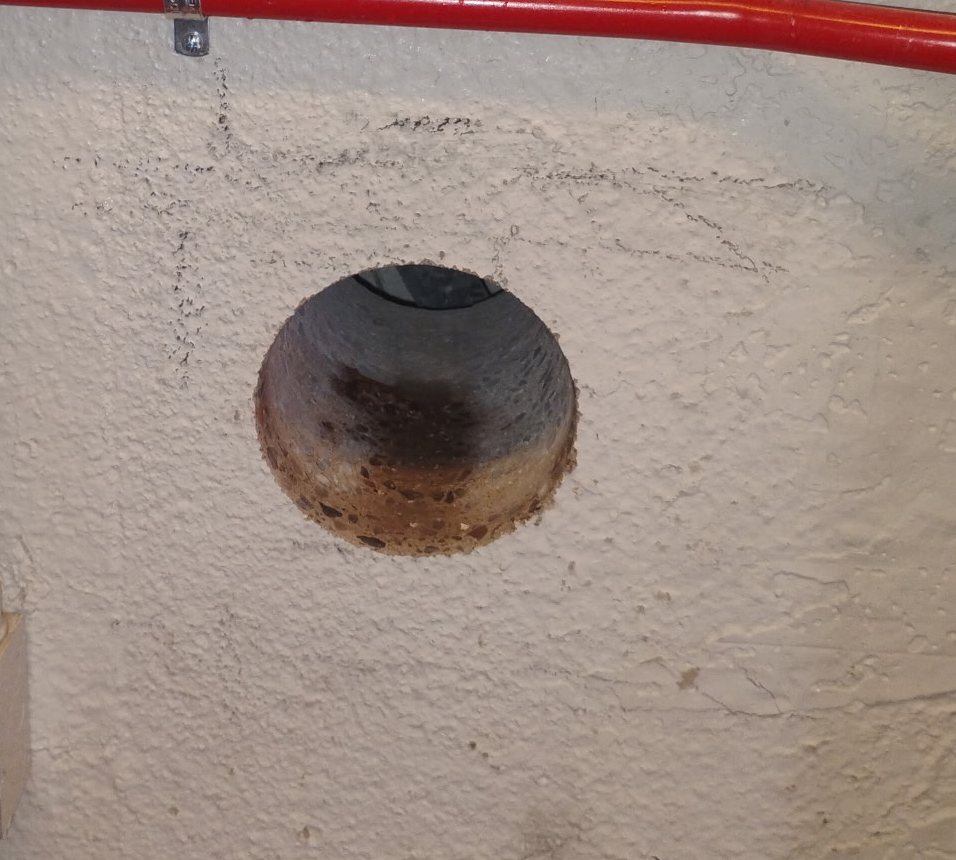 Clean core hole through a block wall at a Central Arizona Project checkpoint in Tempe