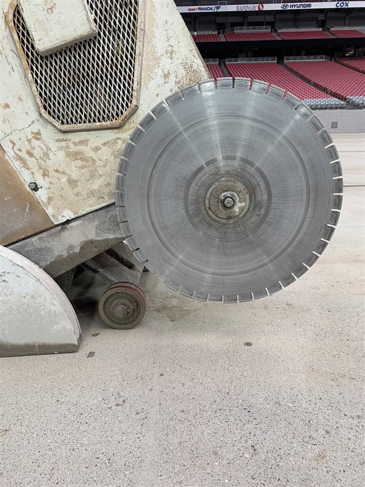 Large diamond blade on a concrete slab saw at Cardinals Stadium, Glendale, Arizona