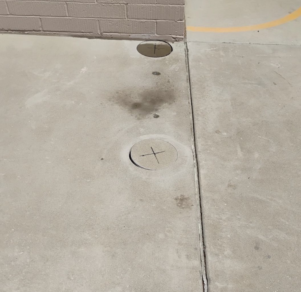 Row of ten inch cores down the walk at Mesa Academy in Mesa