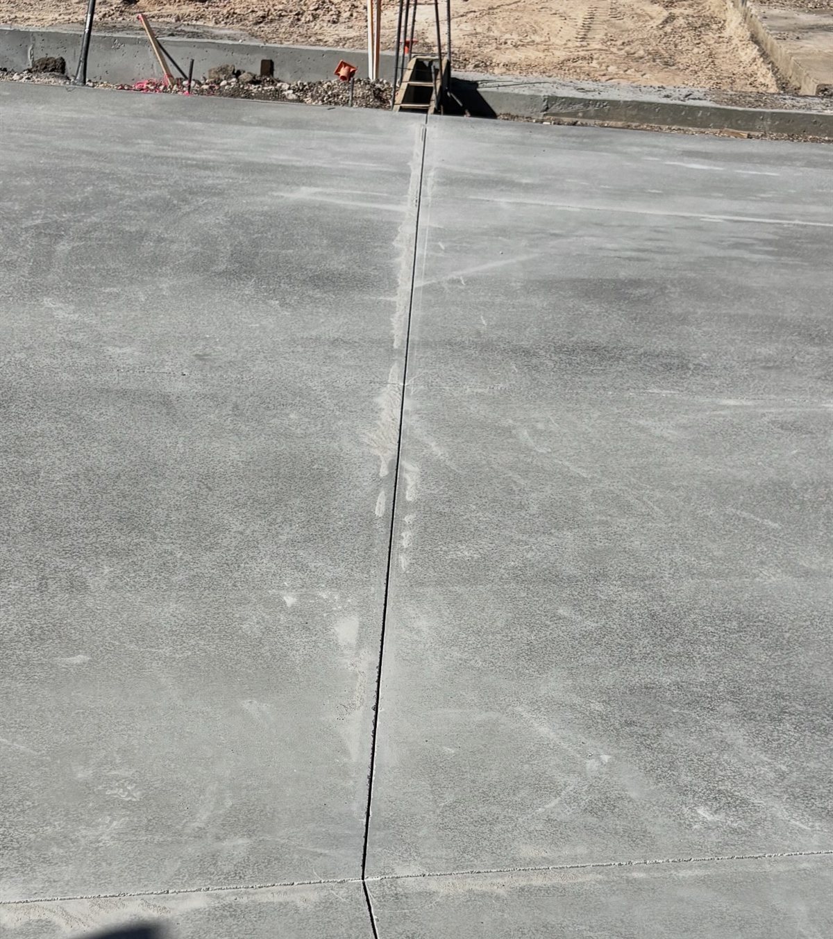 A long straight early entry saw joint down a fresh slab at Papago Marketplace in Scottsdale