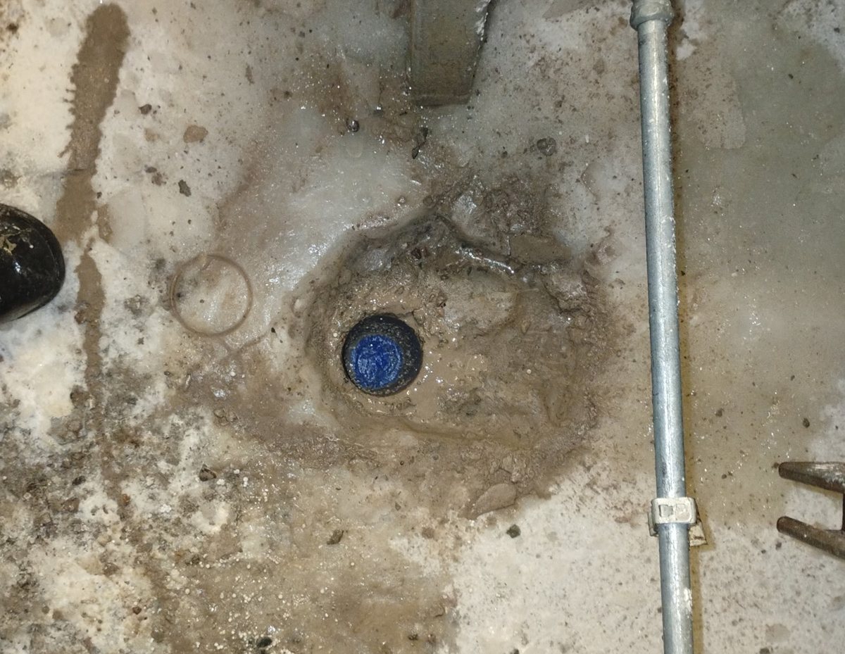 Test core plugged back in the frosted floor of a working bakery freezer in Phoenix