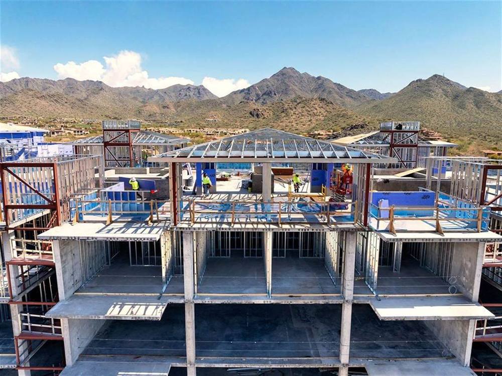 Multi-story job site in north Scottsdale with the McDowell Mountains behind it