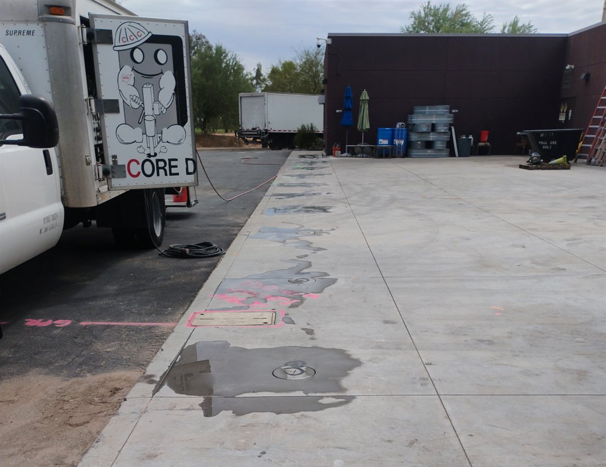Marked 10-inch core locations along the walk at Talking Stick Resort in Scottsdale with the Concrete Coring Company truck alongside