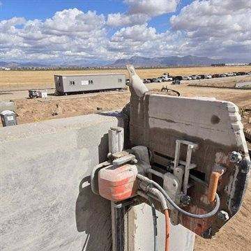 Track-mounted wall saw cutting a tilt-up concrete panel in Phoenix